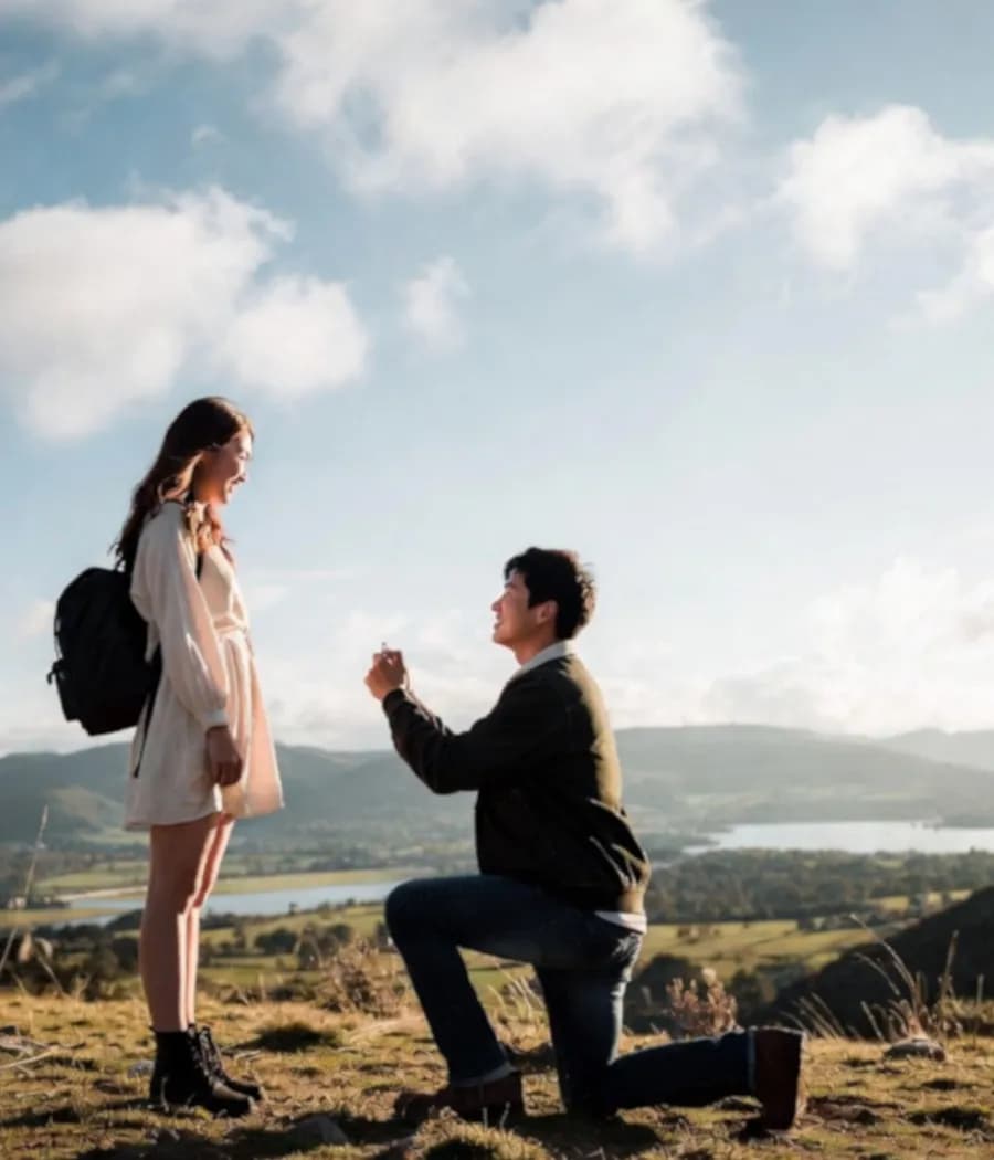Romantic proposal on a hilltop